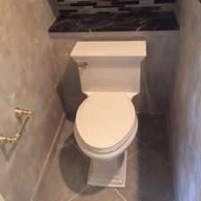 Picture of a beige toilet in a renovated bathroom